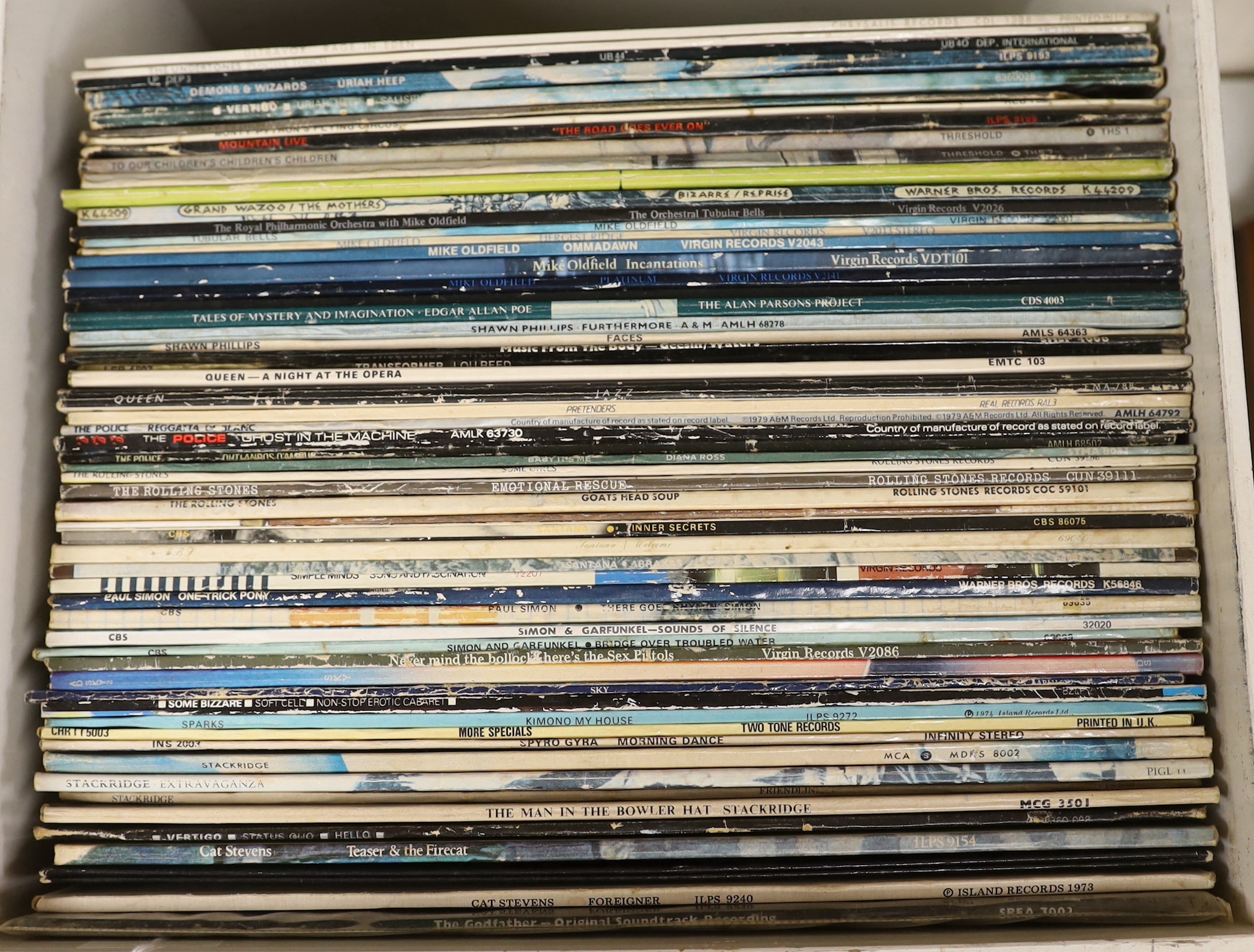 Fifty-eight LP record albums by artists including; Cat Stevens, The Sex Pistols, Simon & Garfunkel, Rolling Stones, the Police, Queen, Lou Reed, Mike Oldfield, Uriah Heep, Ultravox, etc.